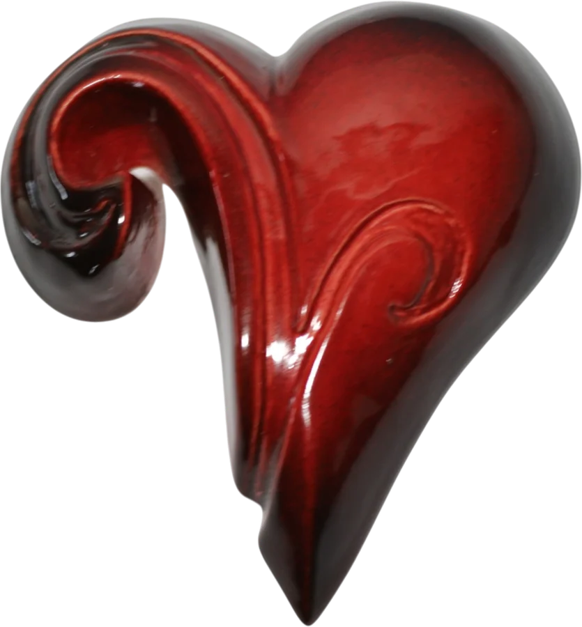 Glossy red ceramic heart whose top curls over into a koru spiral