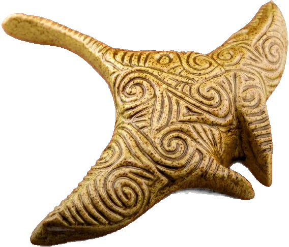 Sandy gold ceramic manta ray carved all over with koru swirls