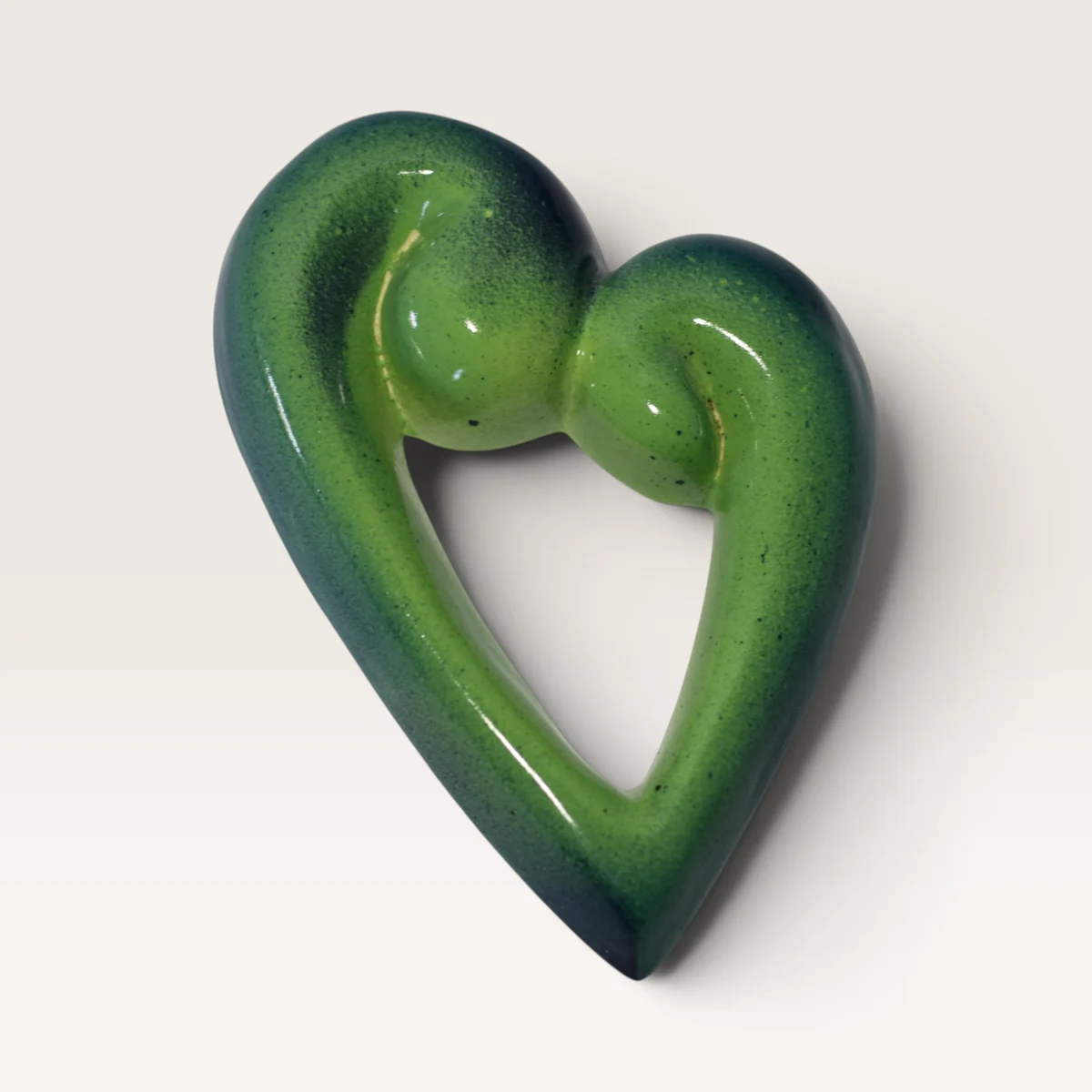 Large open koru heart in bright lime green, shading to dark teal at the edges